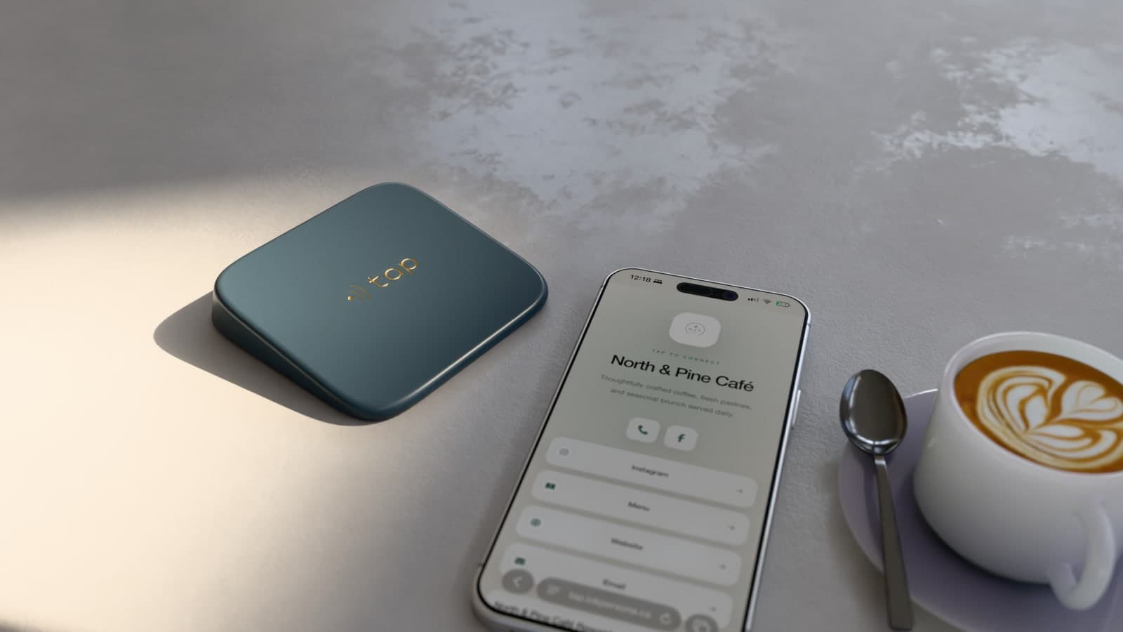 Product render of a forest-coloured Tap device beside a phone showing the North & Pine Café page on a café counter.