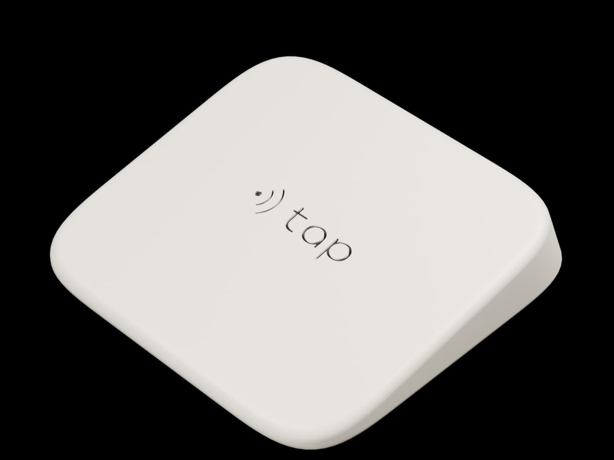 Studio render of the supplied ivory Tap counter device, with its recessed Tap mark.